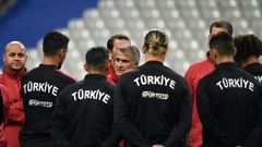 Turkey coach Senol Gunes speaks to his players ahead of their Euro 2020 qualifier against France on Monday, which will be played against a tense diplomatic backdrop