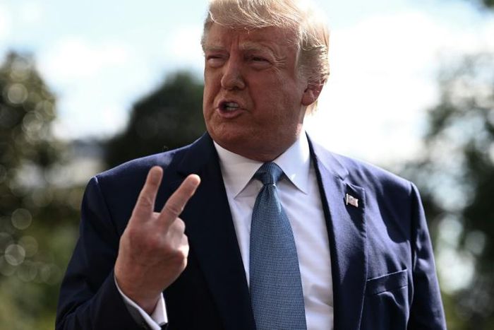 US President Donald Trump, seen in this file photo on October 4, 2019 speaking to the press from the White House lawn, has called the impeachment inquiry a 'scam' by Democrats