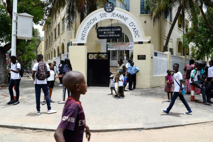 At least four people were arrested for demonstrating in front of the Catholic school in protest of the veil ban