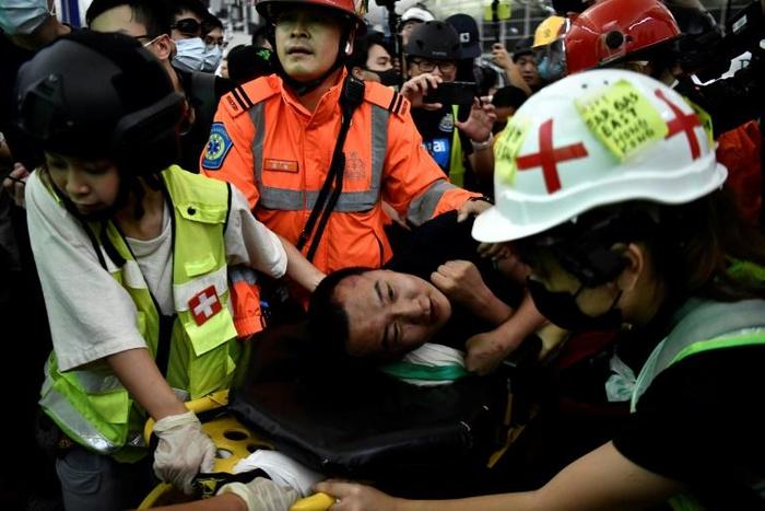 "We express the strongest condemnation of these terrorist-like actions," a Chinese official said calling the two men beaten by demonstrators "mainland China compatriots"