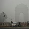 India Gate in New Delhi is pictured through a choking smog that has blanketed the capital