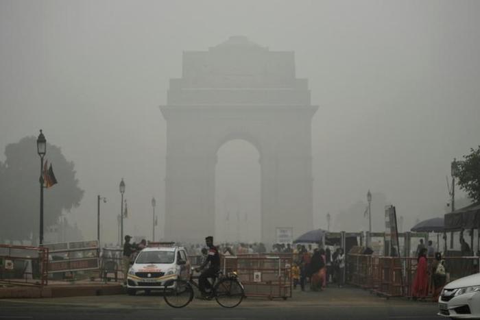India Gate in New Delhi is pictured through a choking smog that has blanketed the capital
