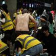 Anti-government protesters sprayed by pepper-water and teargas being treated by volunteer medics the Polytechnic University of Hong Kong