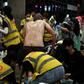 Anti-government protesters sprayed by pepper-water and teargas being treated by volunteer medics the Polytechnic University of Hong Kong
