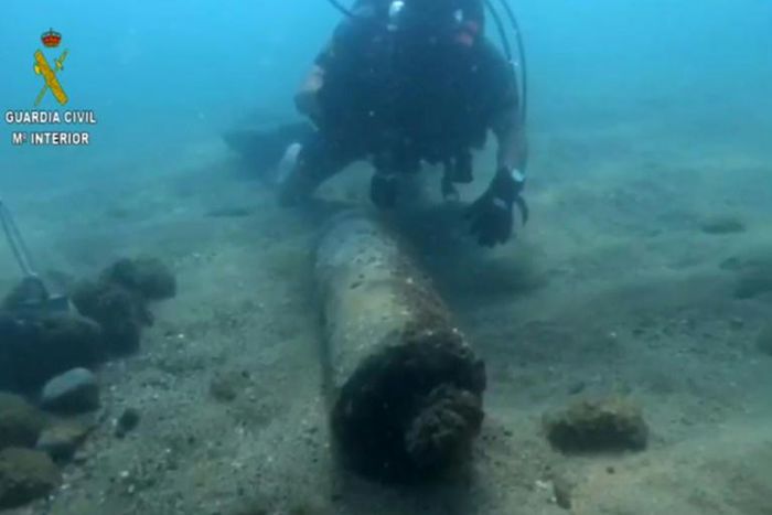 This handout picture from the Spanish Guardia Civil shows a diver checking a bomb, dating back to Spain's 1936-9 civil war, found 25 metres (yards) from the shore in Barcelona.