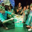 Austrian Green party head Werner Kogler holds a placard reading 'We only borrowed the earth from our children' after the exit poll results came in on Sunday