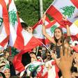 Protests took place across Lebanon, with demonstrators waving Lebanese flags in the crowd in the southern city of Sidon