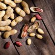 Peanuts on rustic wood table