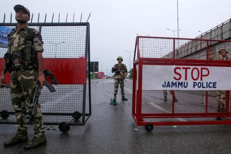 Tens of thousands of troops have enforced a strict curfew, which includes no internet or phone services, in Indian Kashmir