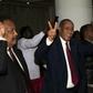 Delegation members of Sudan's transitional government react after two-week long peace talks with rebels in Juba in October