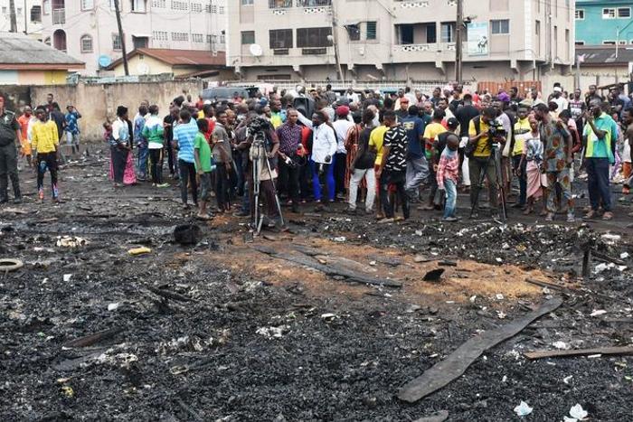 Crowd at the site of the Fire incident at Okobaba Ebute by Jeba, Lagos Mainland Local Government, during the visit of the Representatives of  Lagos Governor, Babajide Sanwo-Olu on Sunday (NAN)