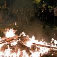 Protesters set fire to barricades during a protest in Barcelona on October 16