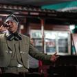 Venezuelan nurse Edgar Fernandez, who works at a state hospital, sings in mariachi costume at a restaurant at the town of El Junquito near Caracas