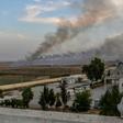 Smoke rises from the Syrian town of Tal Abyad, in a picture taken from the Turkish side of the border on October 10, 2019, on the second day of Turkey's military operation against Kurdish forces