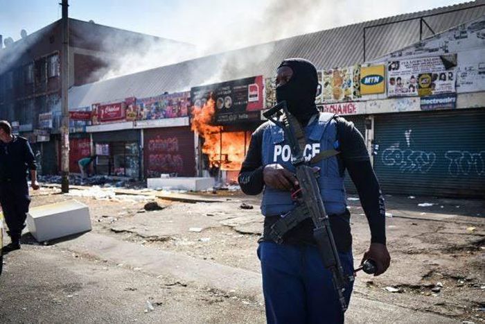 One of the Nigerian-owned shop being razed by the looters in Pretoria Business District on Wednesday (NAN)