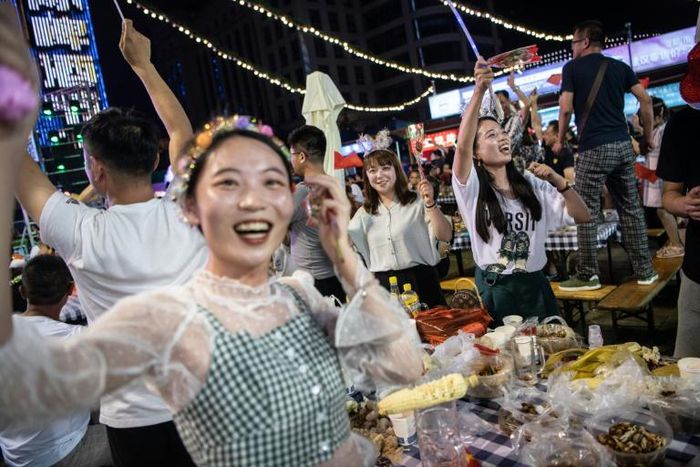 In a setting of mock Bavarian-style cottages, servers dash to and fro with foaming tankards for thirsty visitors