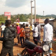 Residents of the community gather around the bank after the robbery incident. (TheCable)