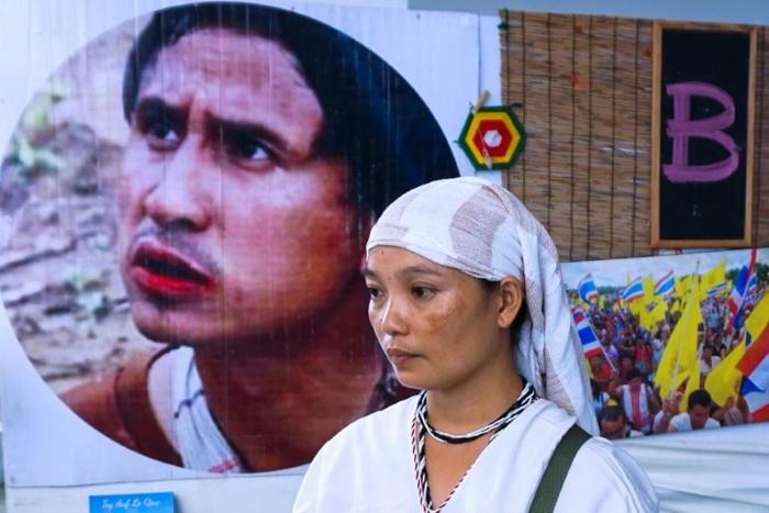 Pinnapha Phrueksapan wiped away tears away at a sombre commemoration ceremony in Bangkok of her husband's life