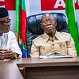 APC national chairman, Adams Oshiomhole, flanked by party men.