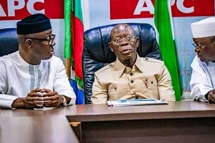 APC national chairman, Adams Oshiomhole, flanked by party men.