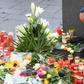 A man wearing a kippah skullcap places a candle at a makeshift memorial a day after two people were shot dead as Halle's Jewish community marked Yom Kippur