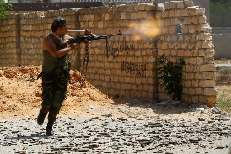 A fighter loyal to Libya's Government of National Accord opens fire on September 7, 2019 -- the UN mission has renewed its mandate and backed struggling ceasefire efforts
