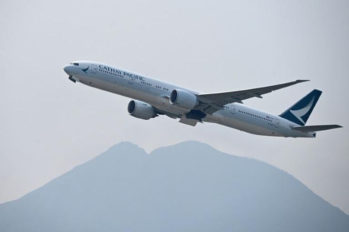 Cathay Pacific has said it will comply with new Chinese rules banning from its airspace staff who support Hong Kong's protesters