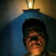 Venezuelan spiritual healer "Brother Guayanese" poses at his clinic in the Caracas neighborhood of Petare