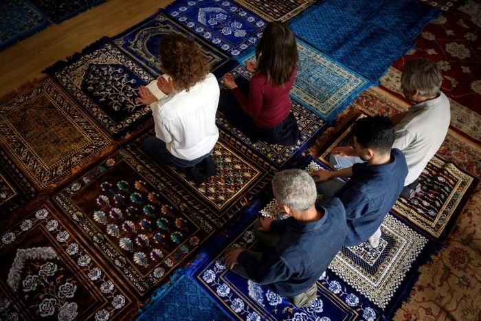 Eva Janadin, left, and Anne-Sophie Monsinay leading prayers in Paris on September 7, 2019