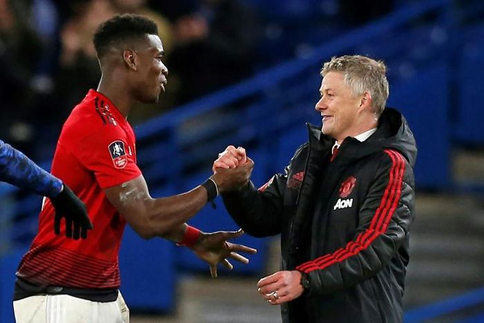 Manchester United manager Ole Gunnar Solskjaer (right) says Paul Pogba is working hard to get back to full fitness