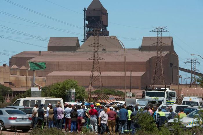 Workers protest outside the Arcellor Mittal Saldanha steel plant against the planned closure of the operation which would result in 900 jobs lost