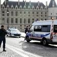Officers on guard Thursday outside the Paris police headquarters, where an employee stabbed and killed four colleagues before being shot dead.