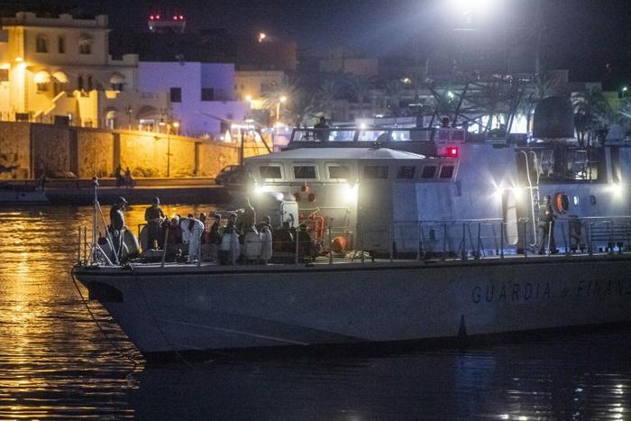Italian authorities identified and carried out medical checks on the African migrants after they disembarked overnight on southern island Lampedusa after more than six days at sea