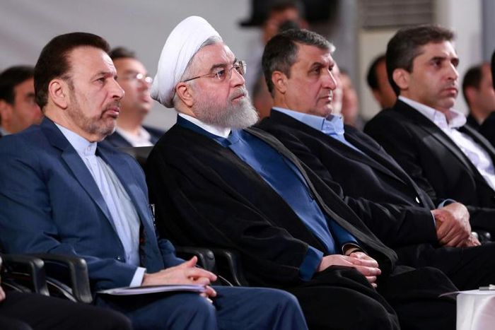 A handout picture provided by the Iranian presidency on August 27, 2019, shows President Hassan Rouhani (2 L) attending a ceremony in the capital Tehran