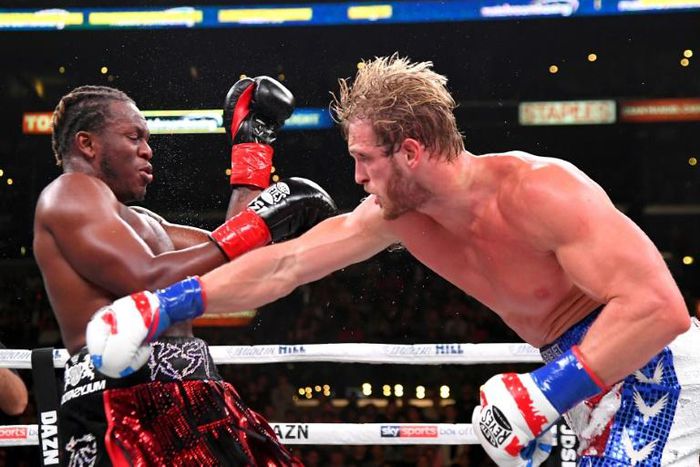 Logan Paul, right, delivers a punch to KSI in their cruiserweight fight Saturday at Los Angeles