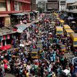 People crowd a street in Lagos ahead of Christmas on December 23, 2016.