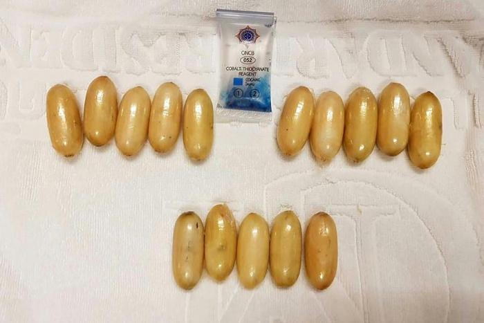 This handout from Thailand's Office of the Narcotics Control Board shows capsules of cocaine found in the possession of Kenyan national Glenn Chibasellow Ooko at Suvarnabhumi airport in Bangkok