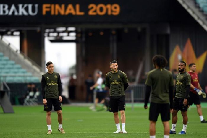 A second man has pleaded guilty to attempting to rob Arsenal stars Mesut Ozil (left) and Sead Kolasinac (centre)