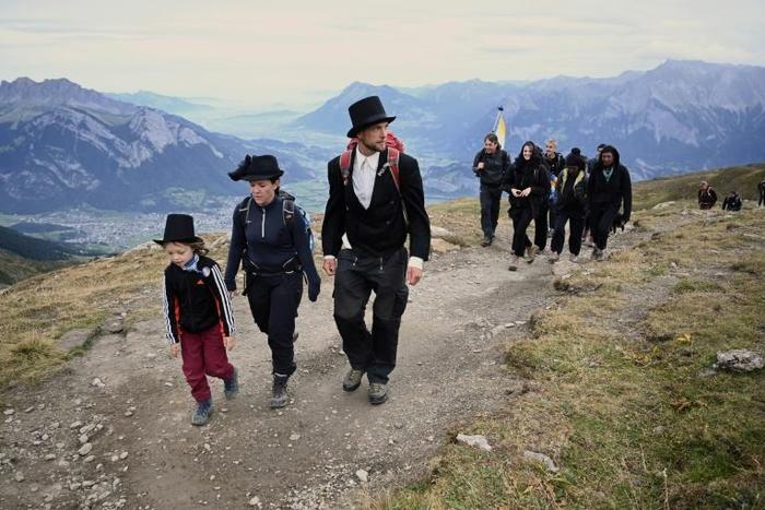 The solemn two-hour "funeral march" led up the side of Pizol mountain in northeastern Switzerland to the foot of the rapidly melting ice formation