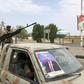 Fighters of the UAE-trained Security Belt Force, dominated by members of the Southern Transitional Council (STC) which seeks independence for south Yemen, patrol a street near the Aden International airport on August 28, 2019