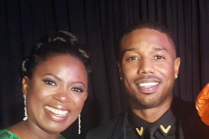 Sope Aluko and Chadwick Bosemanin strike a pose during the premiere of 'Black Panther'. [Instagram/sopealuko]