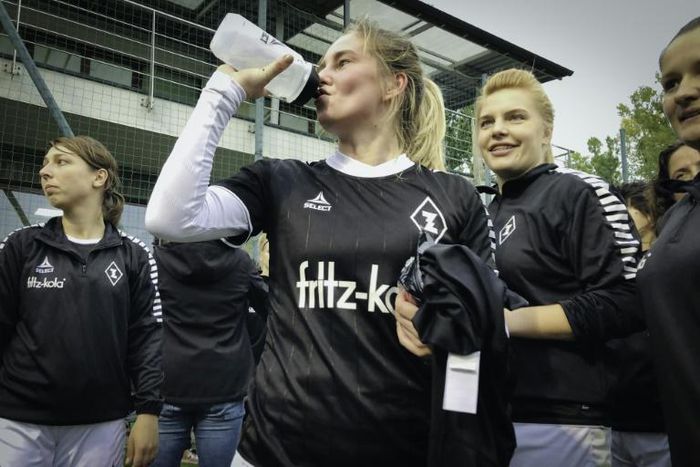 AKS Zly's women's team relax after a home match