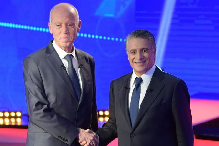 Conservative law professor Kais Saied (L) and business tycoon Nabil Karoui (R) go head-to-head in Tunisia's runoff presidential election