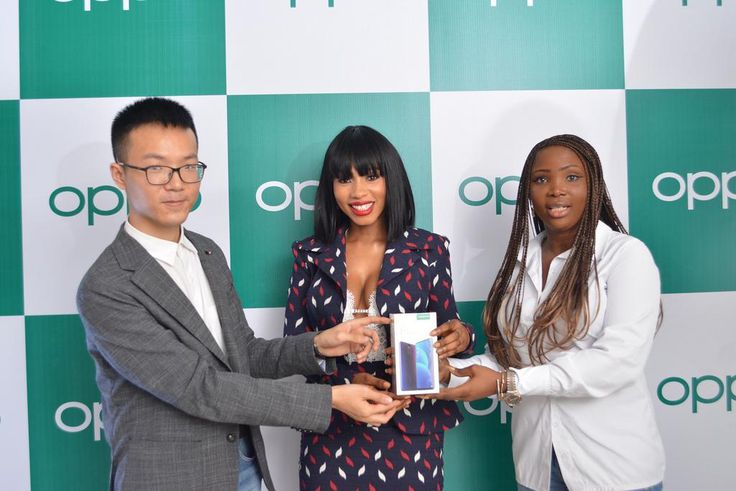 LEFT, Kris Cao, Marketing Director OPPO Nigeria and RIGHT, Nengi Akinola, Marketing Manager, OPPO Nigeria gifiting the OPPO F11 Pro to Mercy at the OPPO Head Office, Lagos