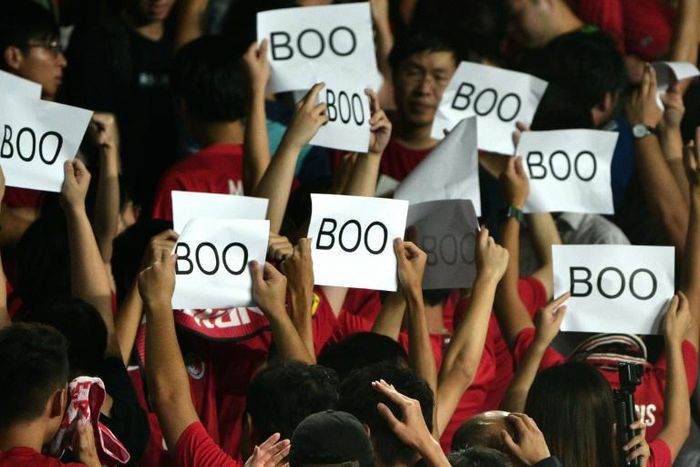 Hong Kong's football body has been fined after fans turned their backs and booed during the Chinese anthem at the start of a World Cup qualifying football match against Iran