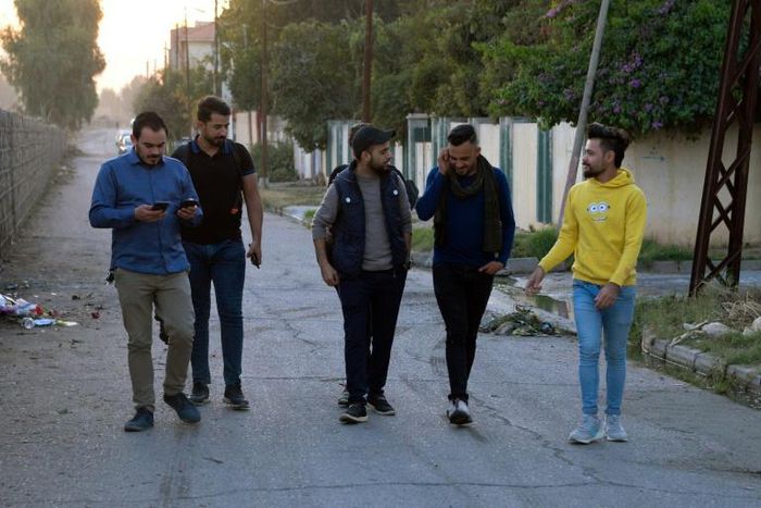 Young men in Iraq's second city Mosul ahead of performing a local adaption of famous Italian resistance song 'Bella Ciao'