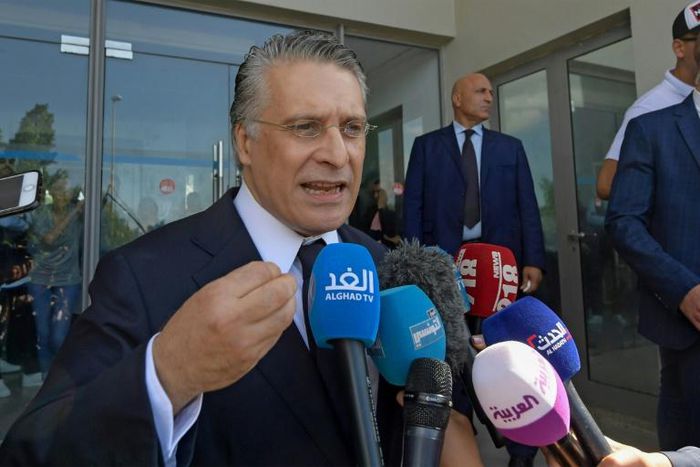 Tunisian presidential candidate Nabil Karoui speaks to journalists after being freed from jail where he was detained for over a month in connection with a money laundering probe ahead of Sunday's election runoff
