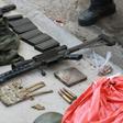A gun, money bag and other items seized from criminals who raided the cargo terminal of the Viracopos International Airport, in Campinas, Sao Paulo state, Brazil, on October 17, 2019