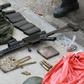 A gun, money bag and other items seized from criminals who raided the cargo terminal of the Viracopos International Airport, in Campinas, Sao Paulo state, Brazil, on October 17, 2019