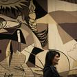 Then-US ambassador to the United Nations Nikki Haley walks past a replica of "Guernica" by Pablo Picasso at the UN headquarters in January 2018